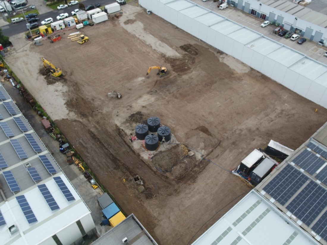 Aerial image of the  former Bradbury Industrial Services site from after the cleanup, showing cleared space with waste and debris removed